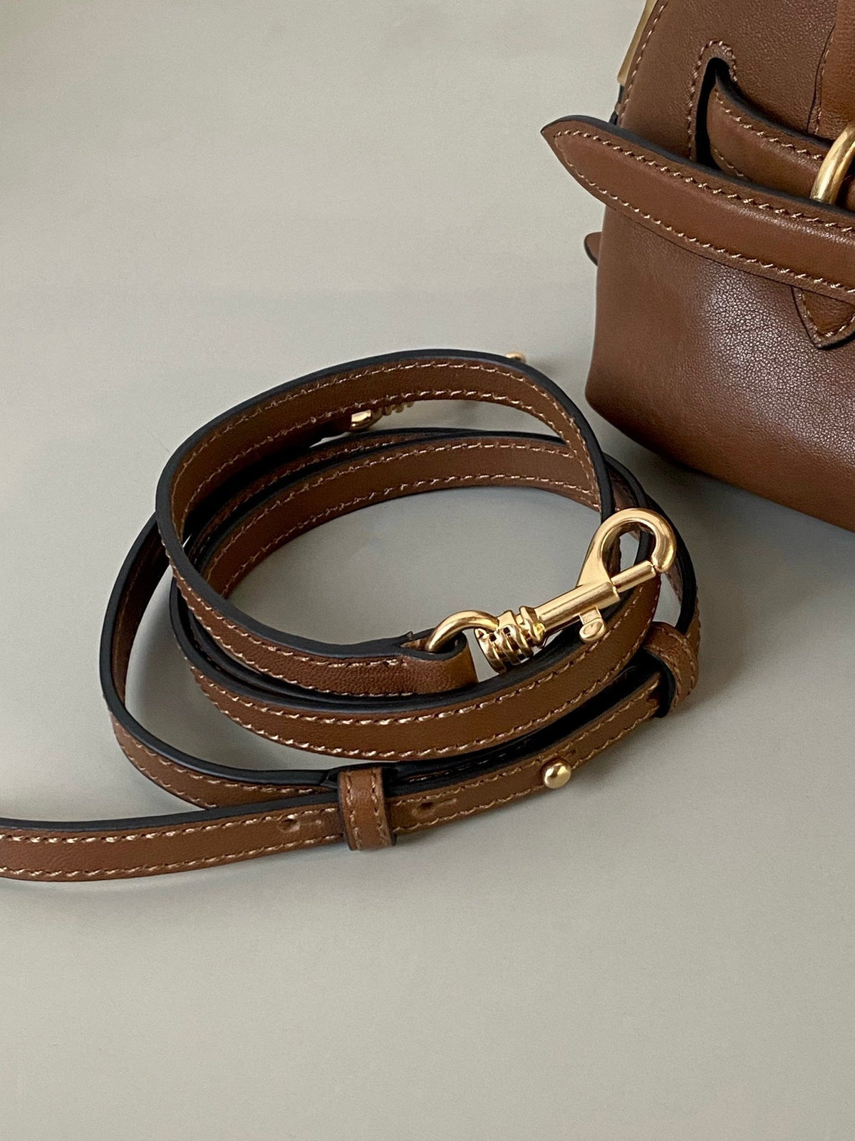 AVENTURE NAPPA MINI BAG 21 IN RUSSET BROWN CALFSKIN GOLD HARDWARE