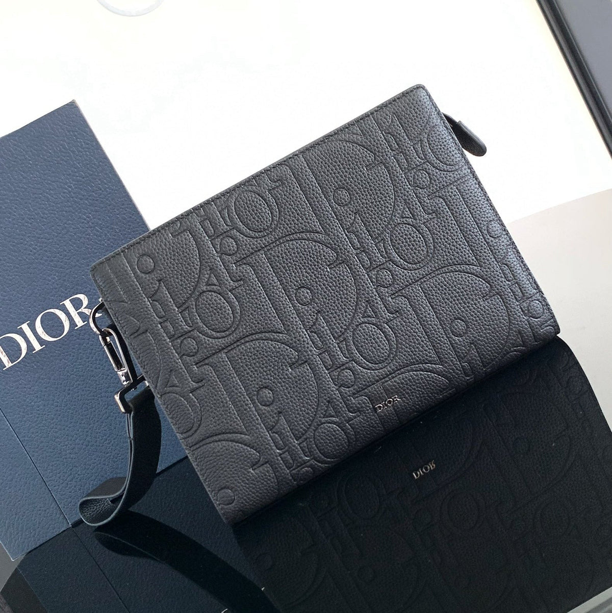 CLUTCH 27 BAG IN BLACK CALFSKIN EMBOSSED LOGO