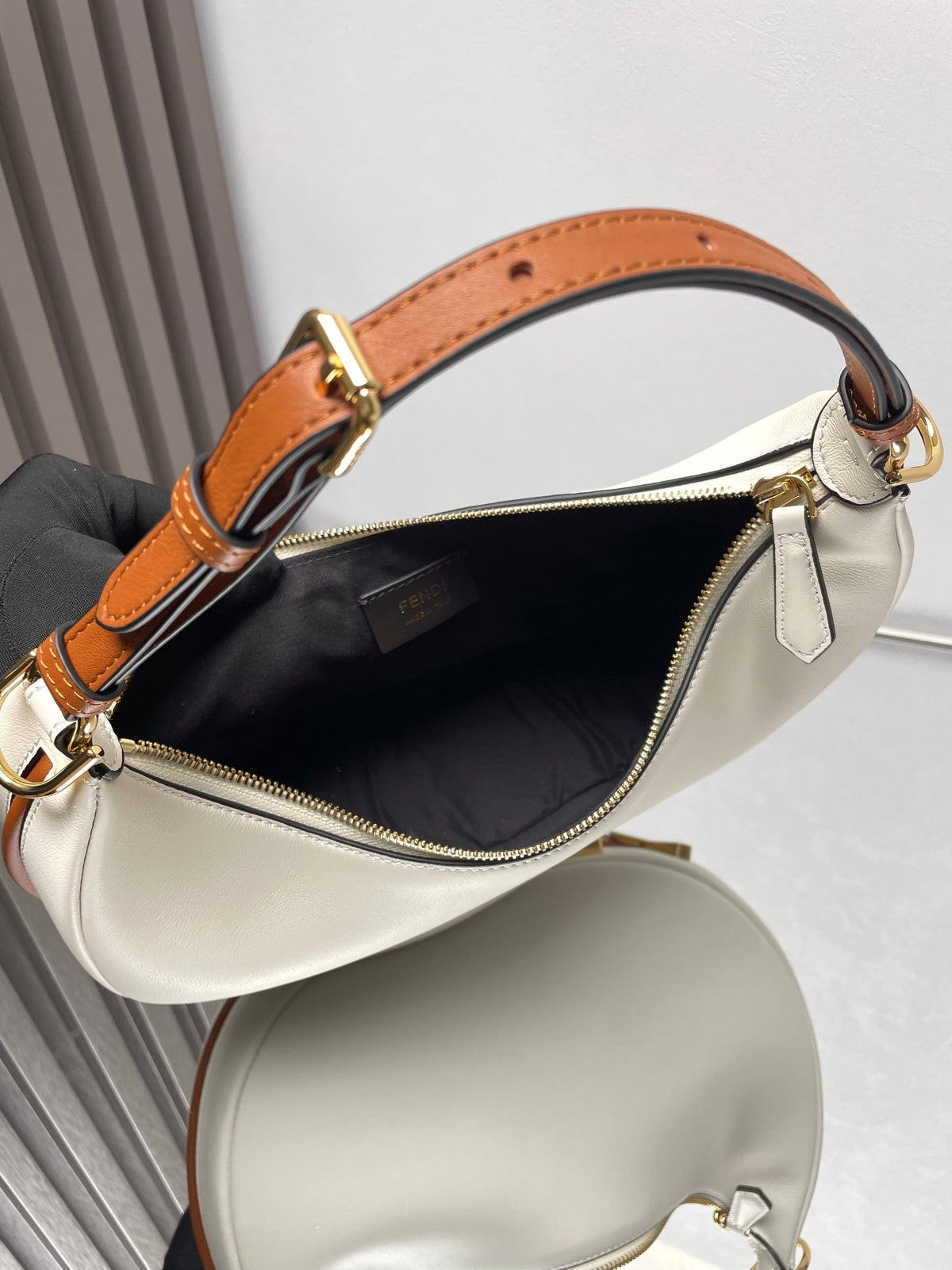 FENDIGRAPHY MEDIUM 29 IN WHITE AND ORANGE TRIM SMOOTH LAMBSKIN GOLD HARDWARE