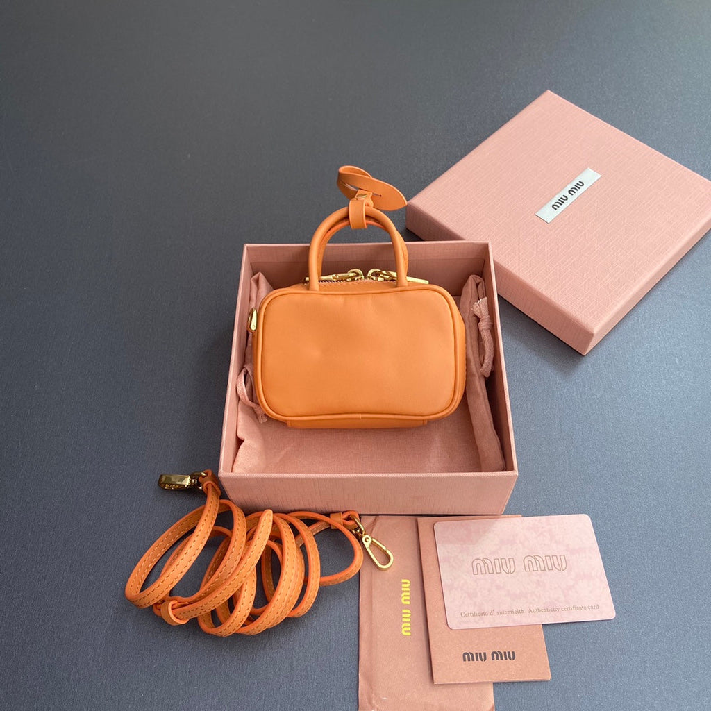 MICRO BAG KEYCHAIN 11 IN HOT CINNAMON ORANGE CALFSKIN EMBOSSED LOGO