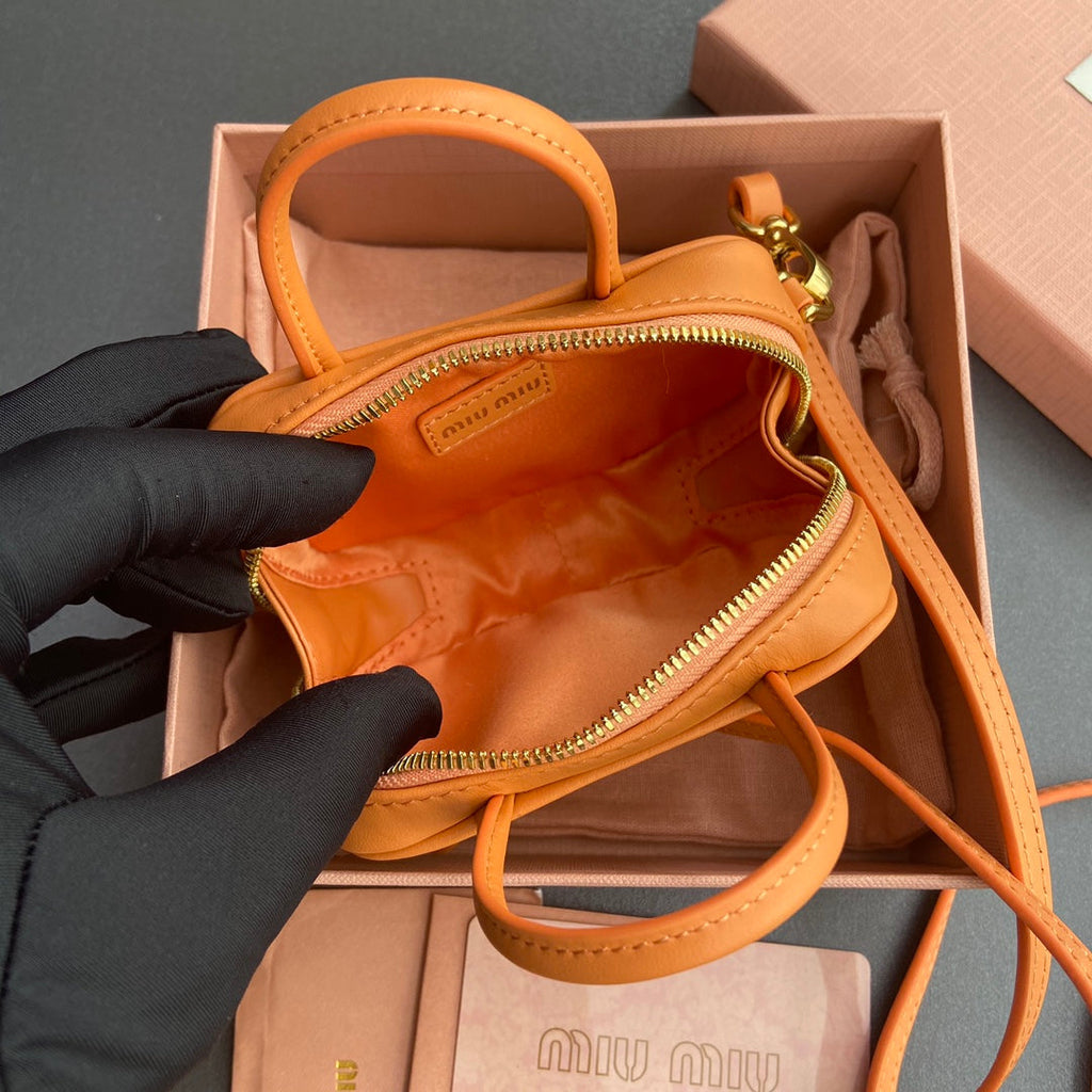 MICRO BAG KEYCHAIN 11 IN HOT CINNAMON ORANGE CALFSKIN EMBOSSED LOGO